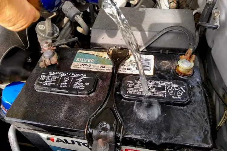 What happens when a car battery goes in the water