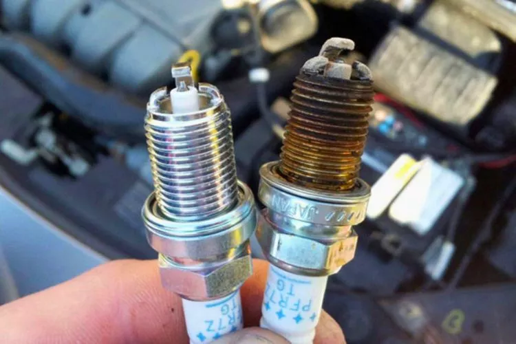 How do you tell if a spark plug is good or bad